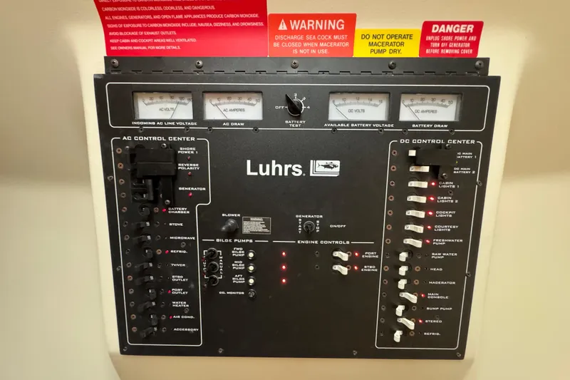 Slide: The Image of Control panel of a 2002 Luhrs 32 Open boat with AC and DC systems. - 22