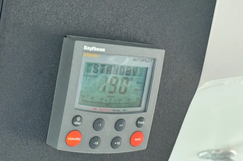 Slide: The Image of Raytheon ST5000+ autopilot display on 2002 Luhrs 32 Open boat dashboard. - 24