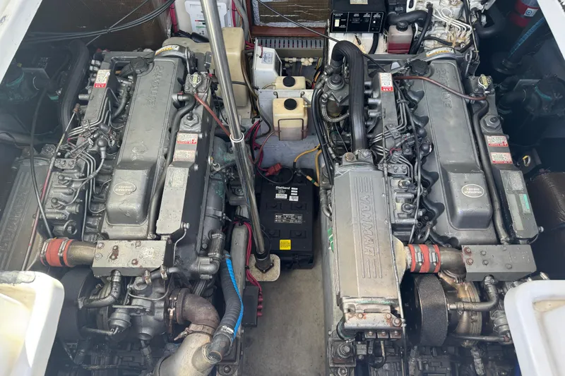 Slide: The Image of Engine compartment of a 2002 Luhrs 32 Open boat, featuring dual Yanmar engines. - 25