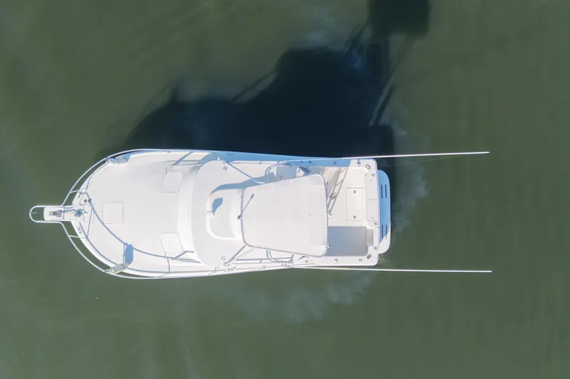Slide: The Image of Aerial view of 2002 Luhrs 32 Open boat on calm water. - 7