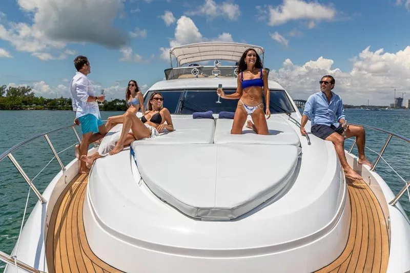 Slide: The Image of People enjoying a sunny day on a 2000 Sunseeker Manhattan 74 yacht. - 17