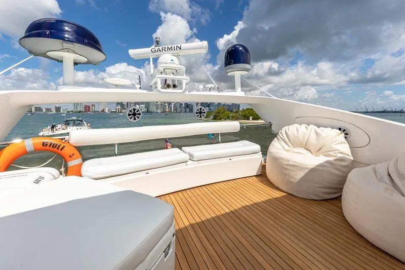 Slide: The Image of Luxurious Sunseeker Manhattan 74 yacht deck with seating, bean bags, and ocean view. - 20