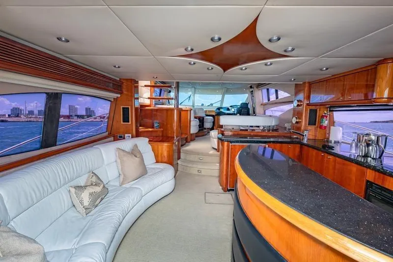 Slide: The Image of Luxurious interior of 2000 Sunseeker Manhattan 74 yacht with elegant wood finishes and spacious seating. - 31