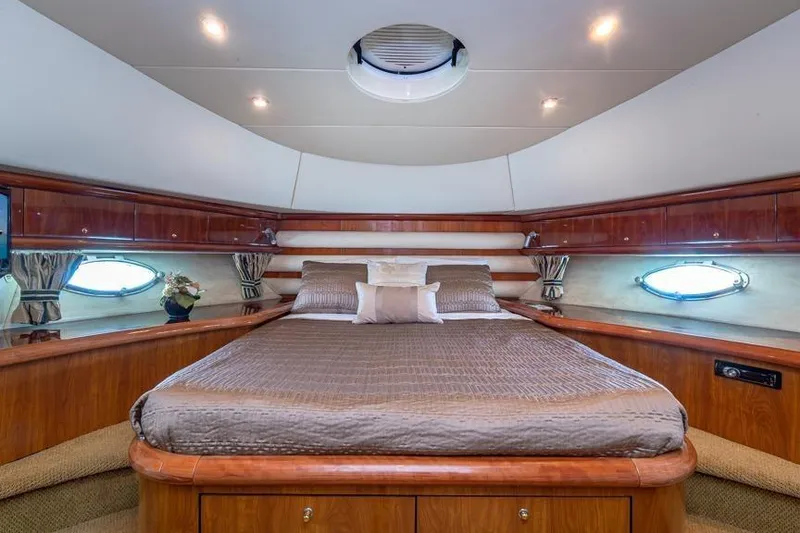 Slide: The Image of Luxurious bedroom interior of 2000 Sunseeker Manhattan 74 yacht with elegant wood finish. - 35
