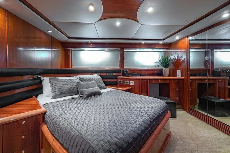 Slide: The Image of Luxurious bedroom interior of 2000 Sunseeker Manhattan 74 yacht with elegant wood finish. - 36