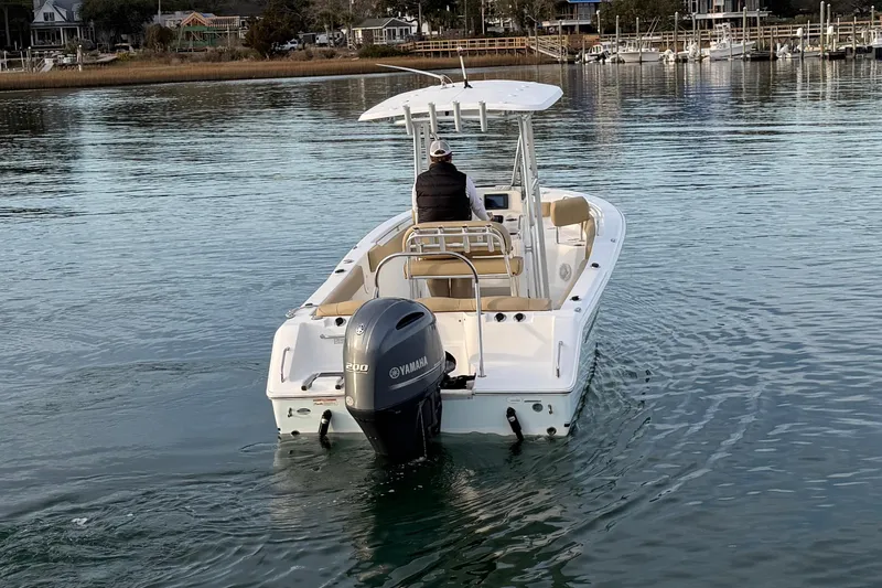 Slide: The Image of 2014 Sea Hunt Ultra 225 boat with Yamaha engine on calm water. - 13