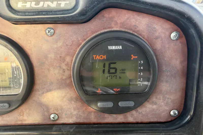 Slide: The Image of Yamaha tachometer on 2014 Sea Hunt Ultra 225 boat dashboard, showing 177 hours. - 17