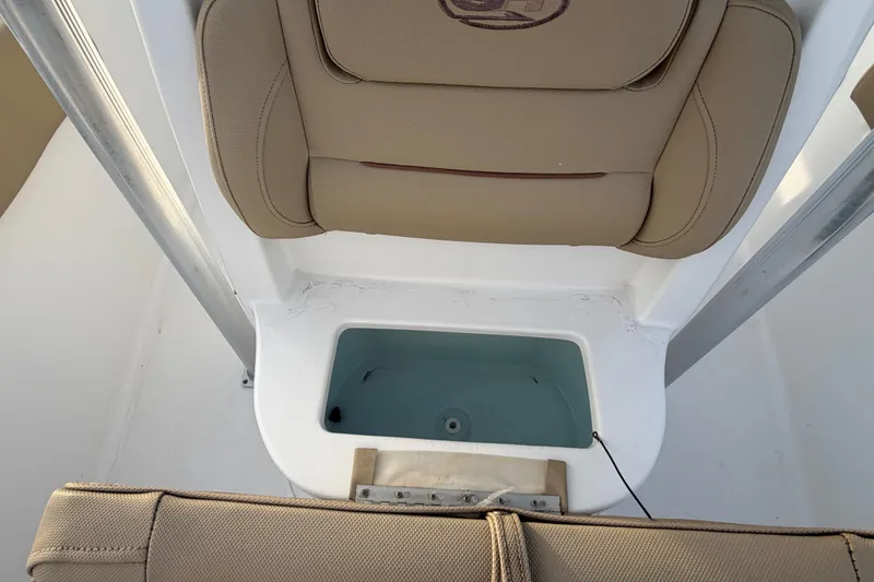 Slide: The Image of 2014 Sea Hunt Ultra 225 boat seat with built-in storage compartment. - 32
