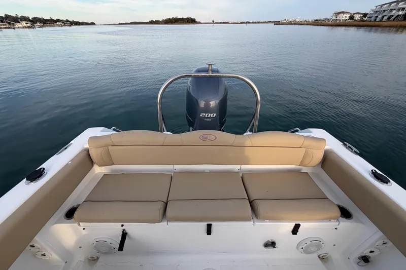 Slide: The Image of 2014 Sea Hunt Ultra 225 boat with Yamaha 200 engine on calm water. - 41