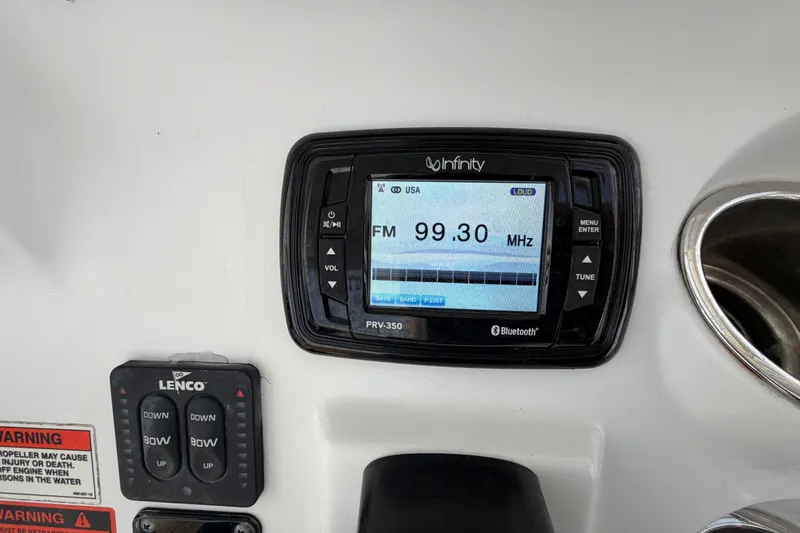 Slide: The Image of Infinity PRV-350 radio display on 2014 Sea Hunt Ultra 225 boat dashboard. - 45