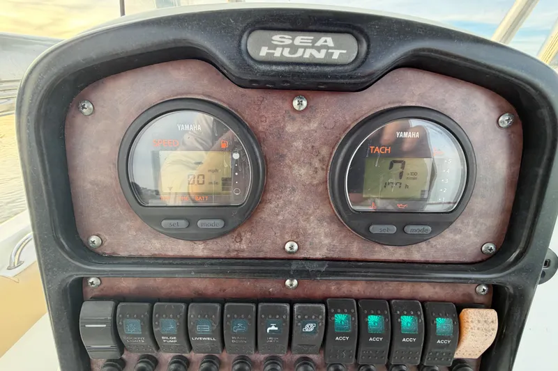Slide: The Image of Control panel of a 2014 Sea Hunt Ultra 225 boat with Yamaha gauges. - 49