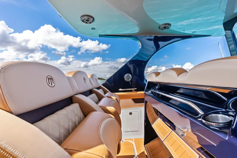 Slide: The Image of Luxurious interior of 2021 Mystic Powerboats M4200 with plush seating and sleek design. - 19