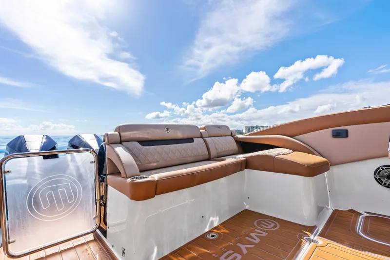 Slide: The Image of 2021 Mystic Powerboats M4200 interior with luxurious seating and ocean view. - 20