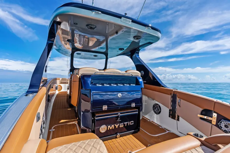 Slide: The Image of 2021 Mystic Powerboats M4200 interior with luxurious seating and ocean view. - 22