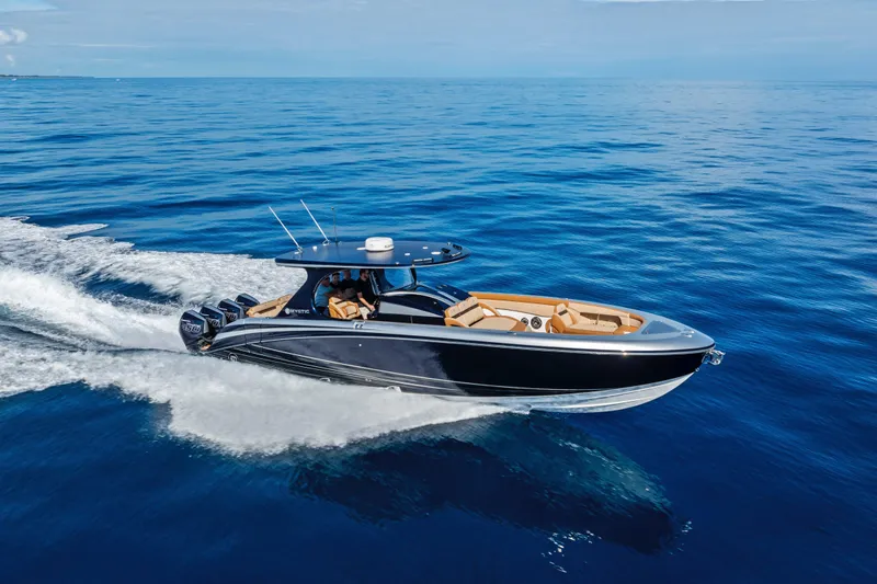Slide: The Image of 2021 Mystic Powerboats M4200 cruising on open blue ocean waters. - 8