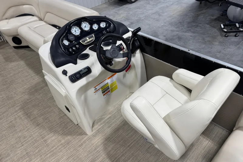 Slide: The Image of 2018 Landau Atlantis 250 boat helm with steering wheel and gauges. - 10