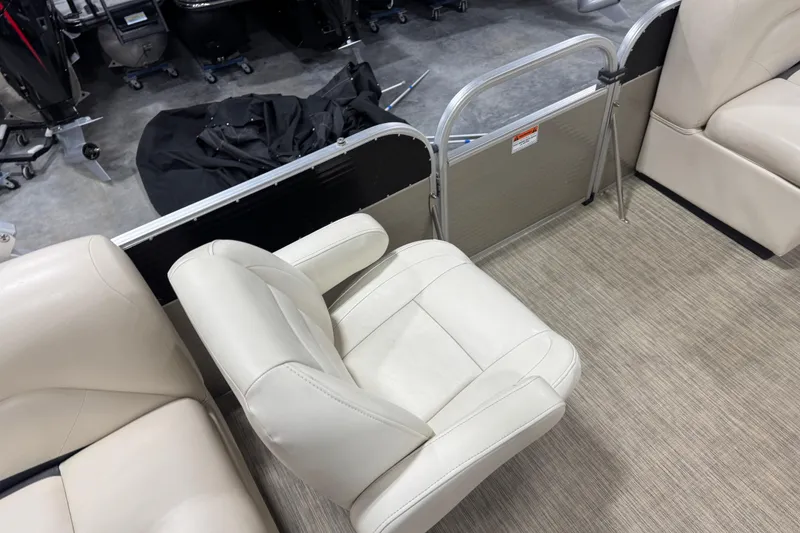 Slide: The Image of 2018 Landau Atlantis 250 boat interior with beige seating and carpeted floor. - 11