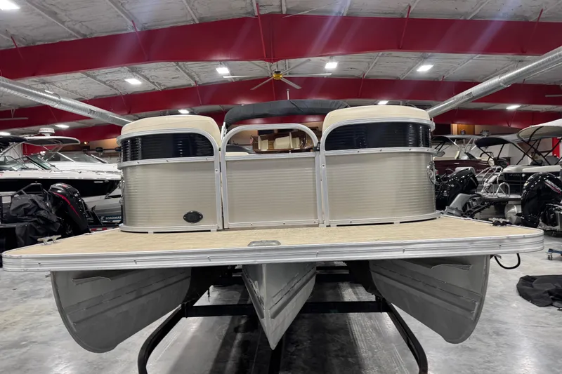 Slide: The Image of 2018 Landau Atlantis 250 pontoon boat displayed in indoor showroom. - 7