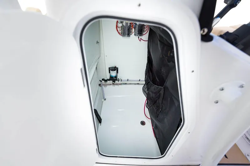 Slide: The Image of Manufacturer Provided Image: 2021 Sportsman Heritage 211 Center Console storage compartment. - 16