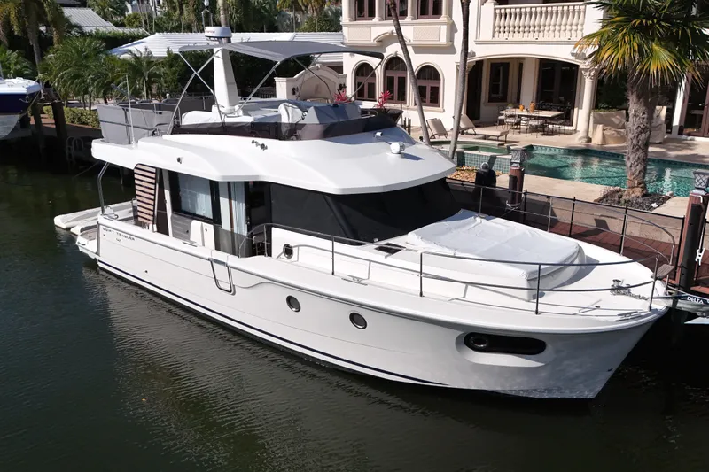 The Image of 2025 Beneteau Swift Trawler 41 Fly at Miami Boat Show, Ramp 7-8, cruising on blue ocean. - 0
