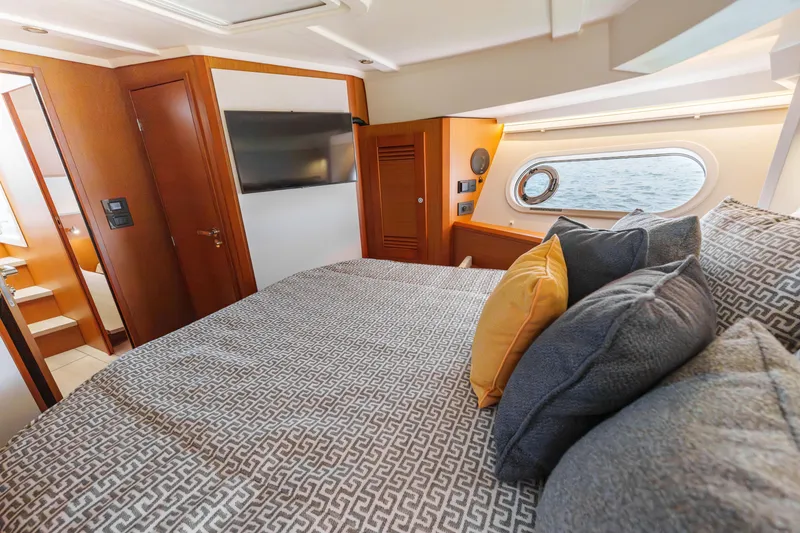 Slide: The Image of Interior of 2025 Beneteau Swift Trawler 41 Fly with cozy seating and table. - 29