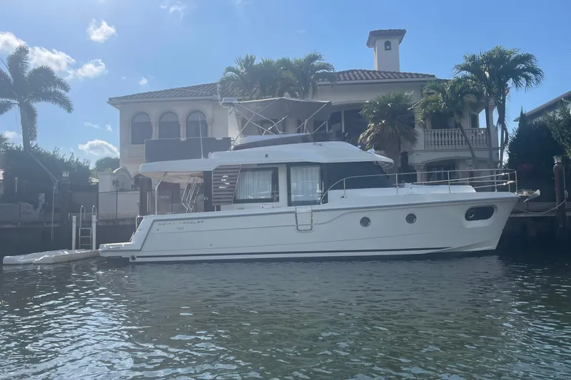 Slide: The Image of 2025 Beneteau Swift Trawler 41 Fly cruising on open blue waters. - 3