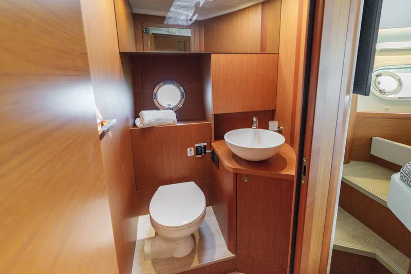 Slide: The Image of Helm of 2025 Beneteau Swift Trawler 41 Fly with navigation controls and display. - 31