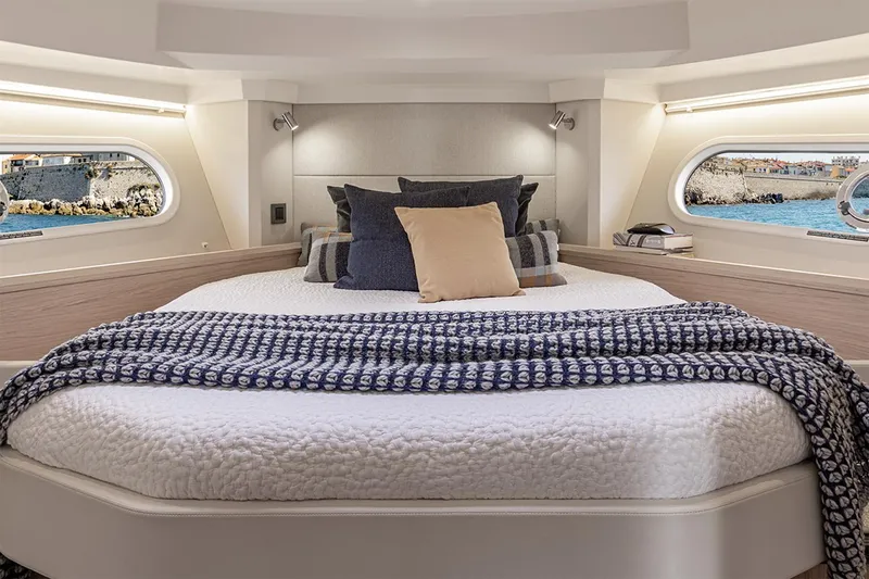 Slide: The Image of 2025 Beneteau Swift Trawler 41 Fly cruising on open sea, rear view. - 6