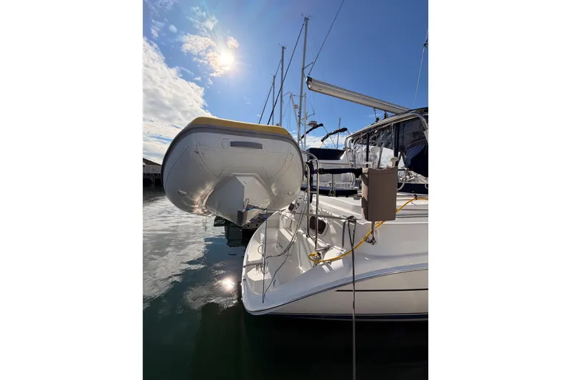 Slide: The Image of 2004 Hunter Passage 420 sailboat docked under a sunny sky. - 10