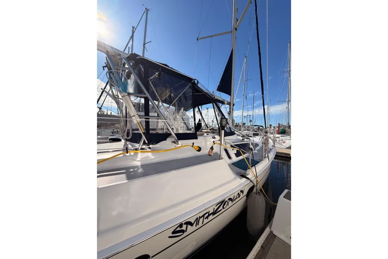 Slide: The Image of 2004 Hunter Passage 420 sailboat docked under clear blue sky. - 12