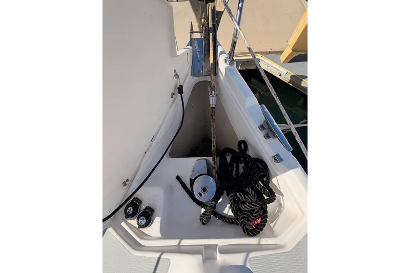 Slide: The Image of 2004 Hunter Passage 420 sailboat anchor locker with ropes and winch. - 18