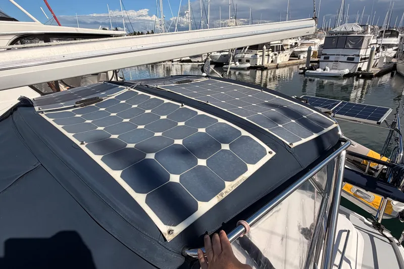 Slide: The Image of Solar panels on a 2004 Hunter Passage 420 sailboat in a marina. - 25