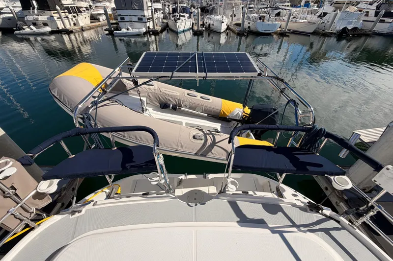 Slide: The Image of Hunter Passage 420 yacht with solar panels and dinghy at marina, 2004 model. - 27