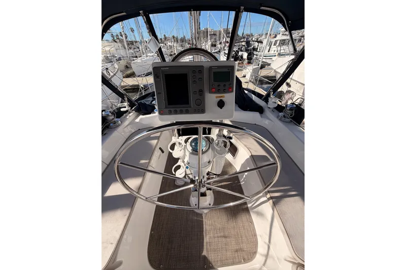 Slide: The Image of Cockpit of 2004 Hunter Passage 420 sailboat with steering wheel and navigation instruments. - 33
