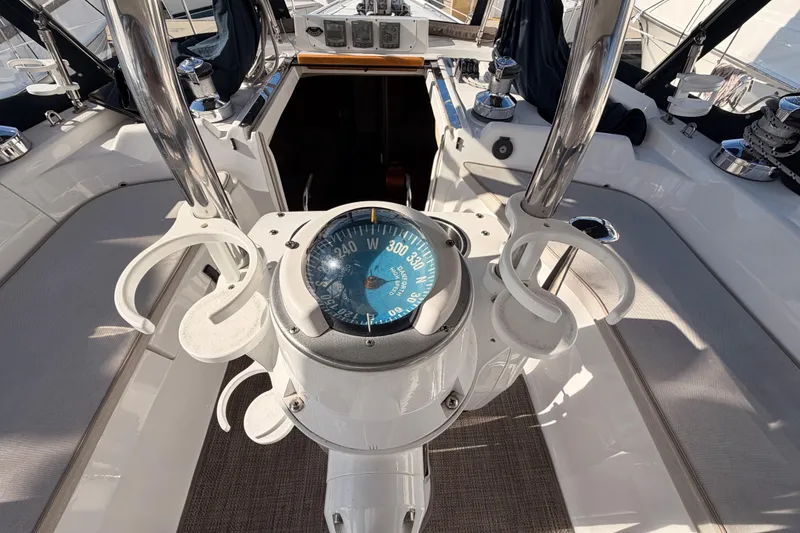 Slide: The Image of Cockpit of 2004 Hunter Passage 420 sailboat with compass and seating area. - 35