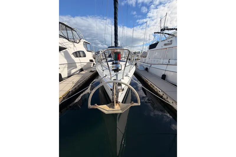 Slide: The Image of 2004 Hunter Passage 420 sailboat docked at marina under blue sky. - 4