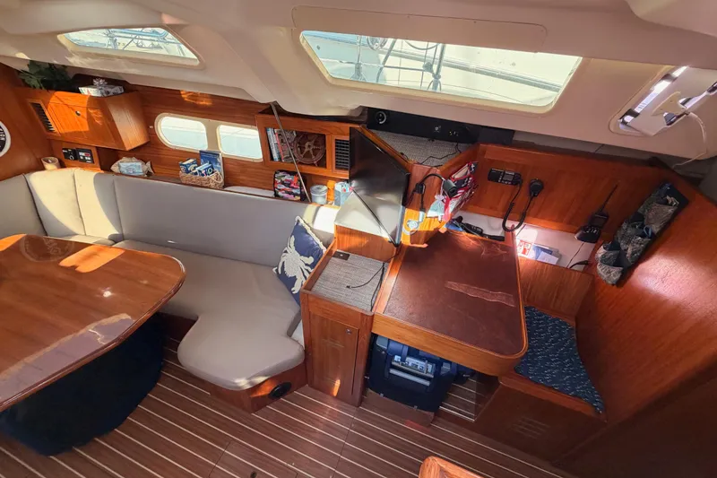 Slide: The Image of Interior of 2004 Hunter Passage 420 yacht with wooden furnishings and seating area. - 46