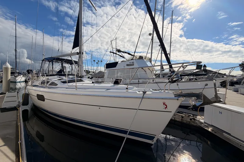 Slide: The Image of 2004 Hunter Passage 420 sailboat docked at marina under partly cloudy sky. - 5