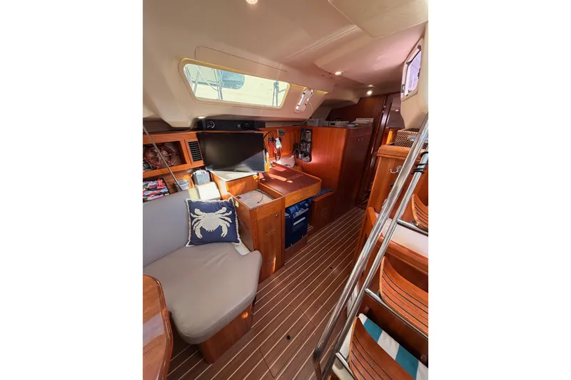 Slide: The Image of Interior of 2004 Hunter Passage 420 yacht with cozy seating and wooden finishes. - 53