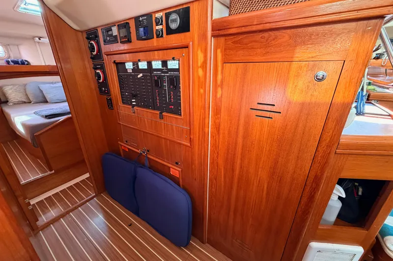 Slide: The Image of 2004 Hunter Passage 420 interior with wood paneling and control panel. - 57