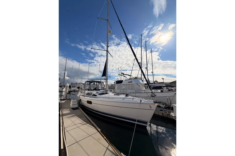 Slide: The Image of 2004 Hunter Passage 420 sailboat docked under a bright blue sky. - 6