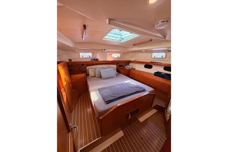 Slide: The Image of Luxurious cabin interior of 2004 Hunter Passage 420 yacht with wooden finishes and skylight. - 63