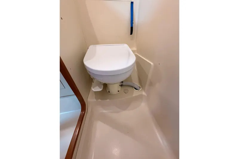 Slide: The Image of 2004 Hunter Passage 420 yacht bathroom with compact toilet. - 69