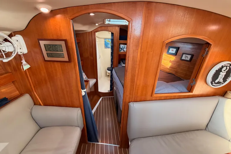 Slide: The Image of Interior of 2004 Hunter Passage 420 yacht with wooden finish and cozy seating. - 78
