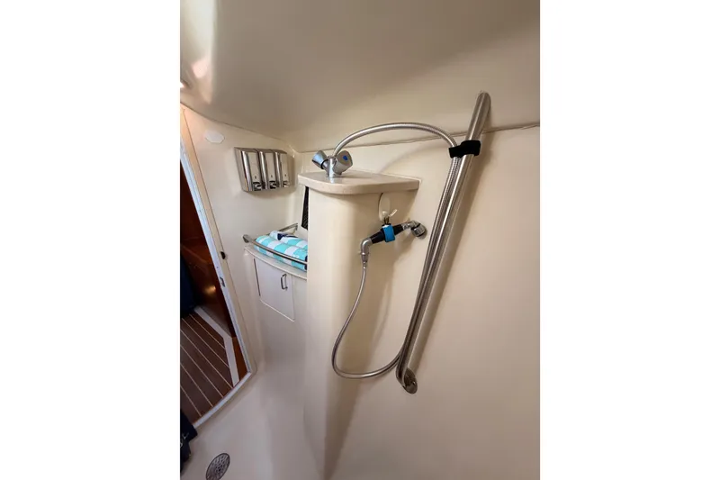 Slide: The Image of 2004 Hunter Passage 420 yacht bathroom with shower and storage. - 83