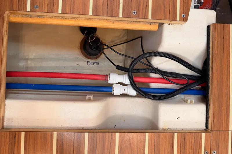 Slide: The Image of Underfloor compartment of 2004 Hunter Passage 420 with red and blue pipes. - 93