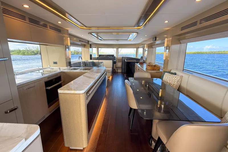 Slide: The Image of Luxurious interior of 2023 Sirena 68 yacht with modern kitchen and dining area. - 25