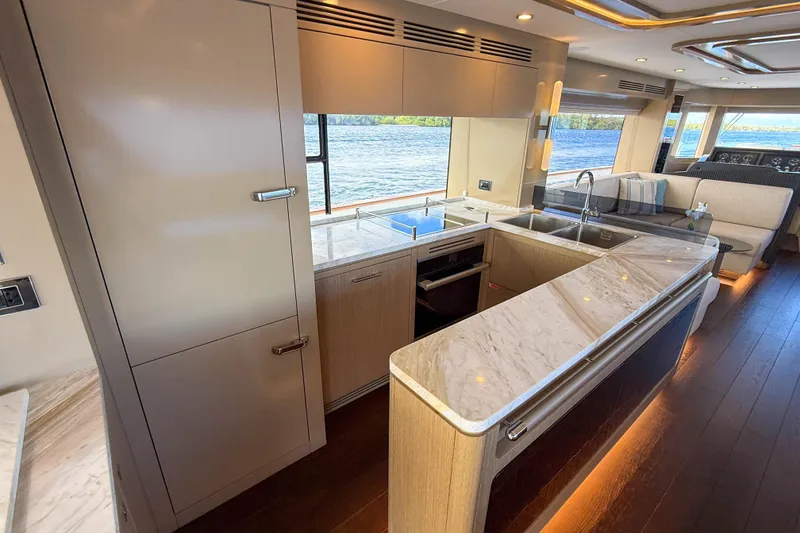Slide: The Image of Luxurious interior of 2023 Sirena 68 yacht with modern kitchen and scenic water view. - 26