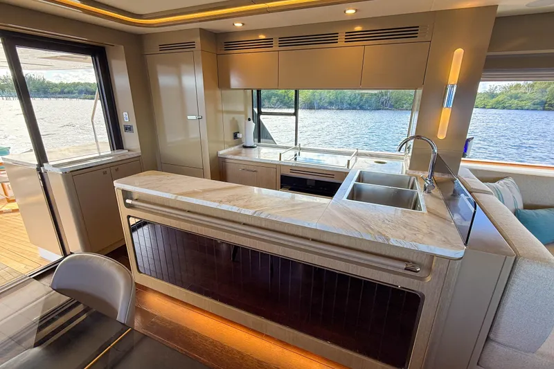 Slide: The Image of Luxurious interior of 2023 Sirena 68 yacht with modern kitchen and scenic water view. - 27