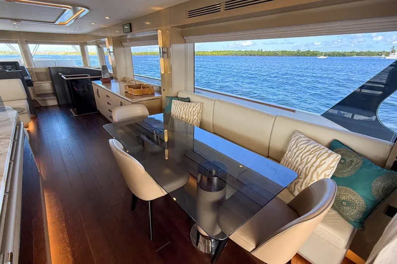 Slide: The Image of Luxurious interior of 2023 Sirena 68 yacht with elegant dining area and ocean view. - 28